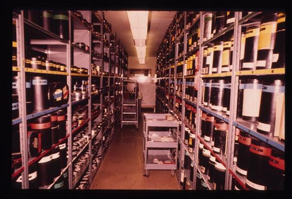 Aerial film in storage at the USGS EROS Data Center, 1974 — the archive that now holds the NHAP and NAPP rolls.